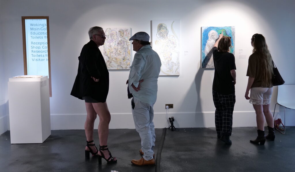 Visitors viewing works in the gallery