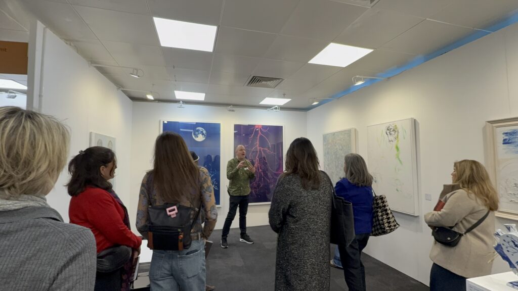 Visitors viewing works on the stand at London Art Fair